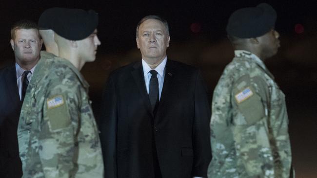 Under Secretary of the Army Ryan McCarthy, left, and Mike Pompeo at the return to US soil of the body of Elis Barreto Ortiz from Afghanistan. Picture: AP