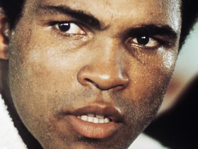 (FILES) This file photo taken on September 10, 1974 shows Former world heavyweight champion US Muhammad Ali posing in Paris, during a stopover on his way to Kinshasa, Zaire, before his world heavyweight championship fight against titleholder US George Foreman on October 30, 1974. Boxing icon Muhammad Ali died on Friday, June 3, a family spokesman said in a statement. "After a 32-year battle with Parkinson’s disease, Muhammad Ali has passed away at the age of 74," spokesman Bob Gunnell said. / AFP PHOTO / -