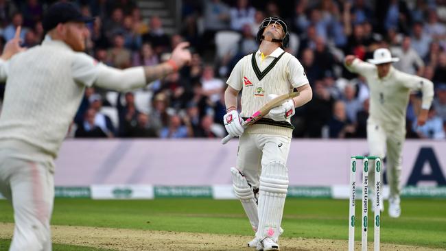 Australia's David Warner reacts to losing his wicket on the first day of the third Ashes cricket Test match between England and Australia at Headingley in Leeds.