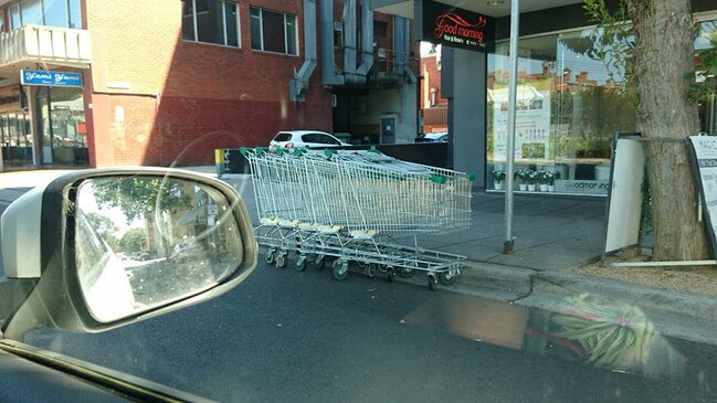 Trolleys dumped in the gutter in Box Hill.