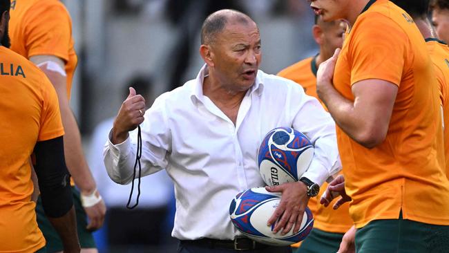 Australia's head coach Eddie Jones leads warm up prior to the  France 2023 Rugby World Cup Pool C match between Australia and Portugal at Stade Geoffroy-Guichard in Saint-Etienne, south-eastern France, on October 1, 2023. (Photo by SEBASTIEN BOZON / AFP)