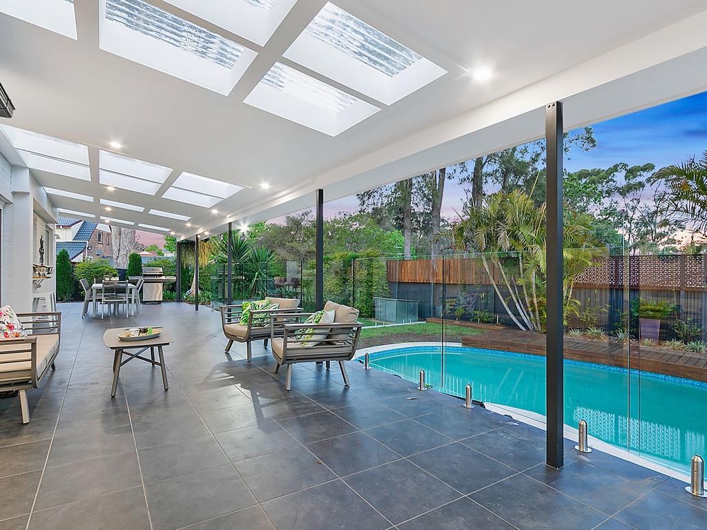 A large terrace overlooks the pool at this Glenhaven property