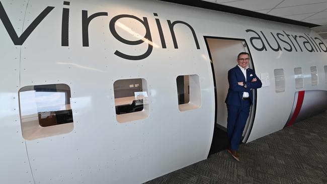 In happier times – Paul Scurrah in his temporary office at the airline’s new headquarters at South Brisbane. Picture: Lyndon Mechielsen