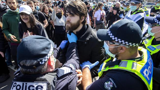 Police arrest protesters breaching restrictions at Queen Victoria Market. Picture: NCA NewsWire / David Geraghty