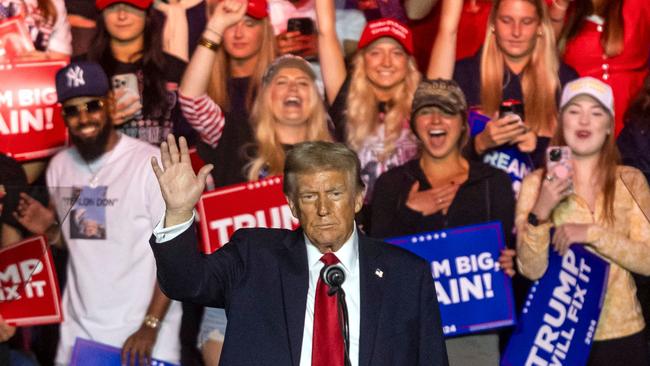 Former US President and Republican presidential candidate Donald Trump waves at supporters during a campaign rally at First Horizon Coliseum in Greensboro, North Carolina. Picture: AFP