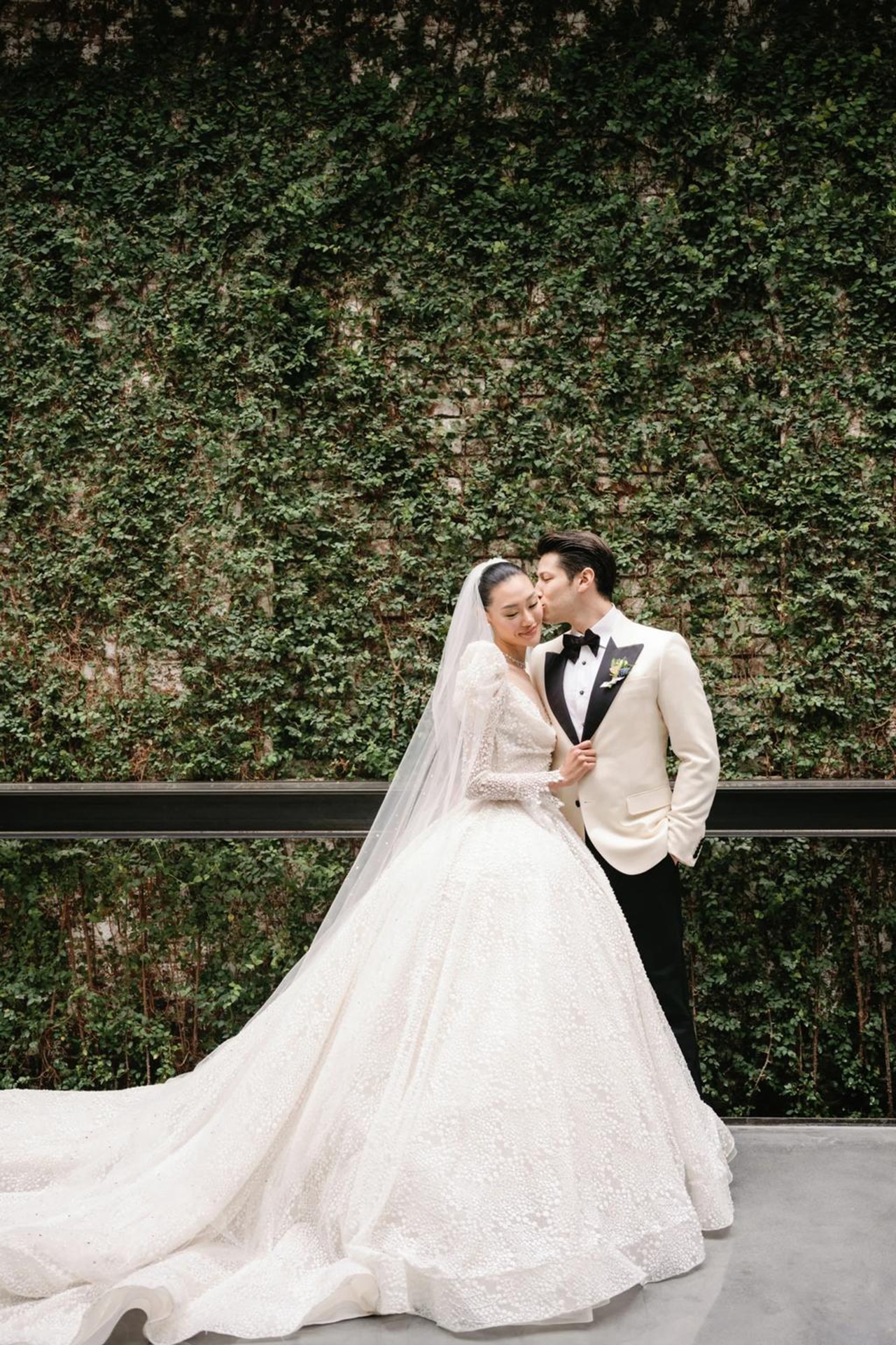 <p><em>Image credits: Samm Blake. <a href="https://www.vogue.com.au/brides/weddings/model-jessie-lis-intimate-new-york-wedding-was-inspired-by-english-country-gardens/image-gallery/c28a01af210d90b92ce0818e273d6d38" target="_blank" rel="noopener">From model Jessie Li&rsquo;s intimate New York wedding was inspired by English country gardens</a></em></p><h2>Jessie Li in The Atelier Couture</h2><p>Model Jessie Li delivered the ultimate princess aesthetic in her Atelier Couture gown at her wedding to Yoni Schanzer in early 2022. Jimmy Choo, creative director of The Atelier Couture delivered an elegant and timeless dress, with ethereal puff sleeves that gave off a sense of royalty. Her gown was covered in intricate lace and beaded detailing, topped off with a beaded veil. The Victorian-inspired gown was paired with diamond stud earrings and a diamond choker from Betteridge. Jessie then partied away at the reception in a gown by Amsale, her hair brushed down and paired with a custom hairpiece designed by Brent Lawler.</p>