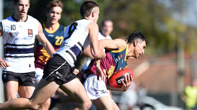 Darcy Wilmot gets a grip on Zak Clarkson. Picture: Steve Tanner