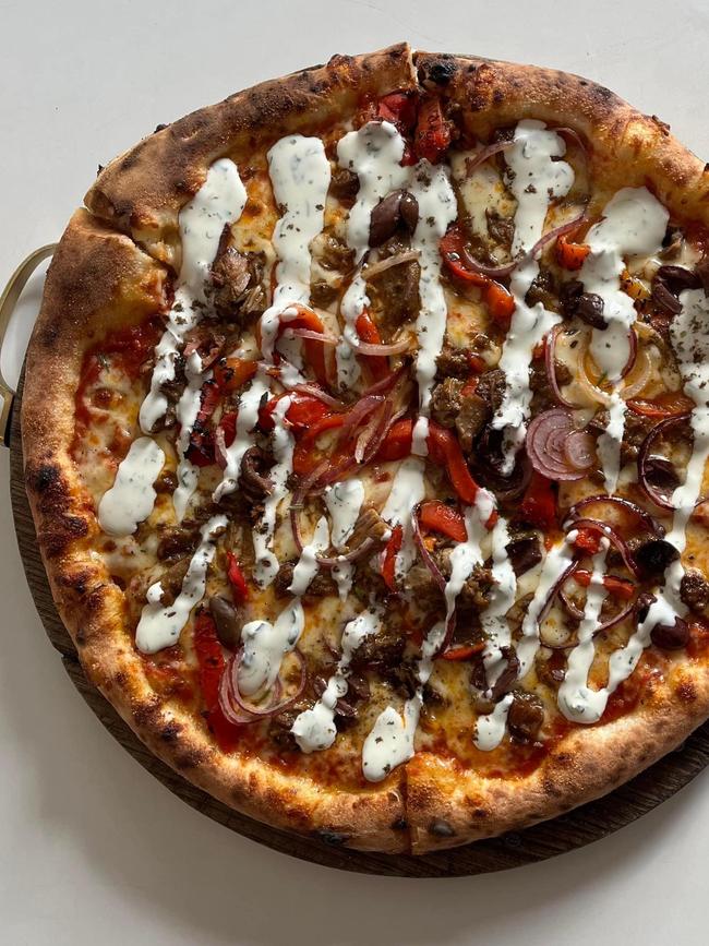 Smolt Kitchen's tasty lamb souv’ pizza which features slow-cooked spiced lamb, roast capsicum, olives, red onion, za’tar and a herb yoghurt. Picture: Supplied