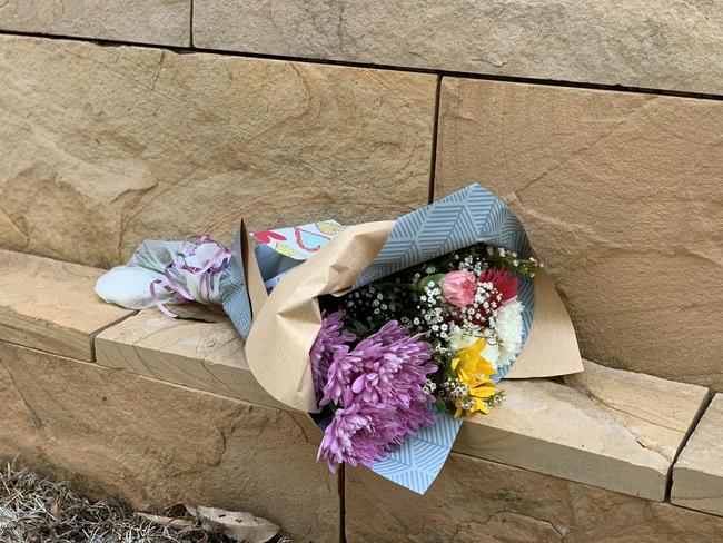 Flowers laid in tribute to the dead woman. Picture: Madelaine Wong