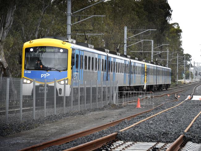 MELBOURNE, AUSTRALIA - NewsWire Photos NOVEMBER 04, 2021: A Metro train runs on the existing track next to the rail duplication project at the Cranbourne rail line in Melbourne's outer south-east. Picture: NCA NewsWire / Andrew Henshaw
