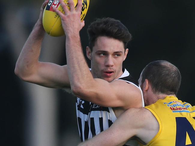 SANFL  Eagles versus Port Adelaide at Woodville Oval. EagleÃs Patrick Giuffreda tackles PortÃs Jed McEntee. 12 June 2021. Picture Dean Martin