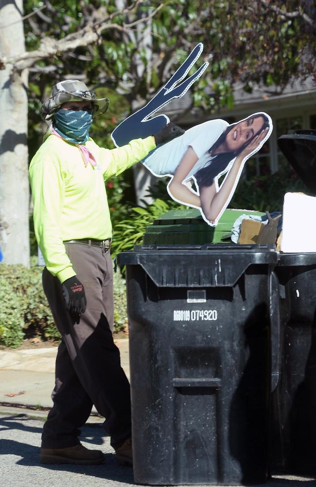 A life size Ana de Armas cutout is thrown in the bin outside of Ben Affleck's house on the day news of their split broke. Picture: TheImageDirect.com