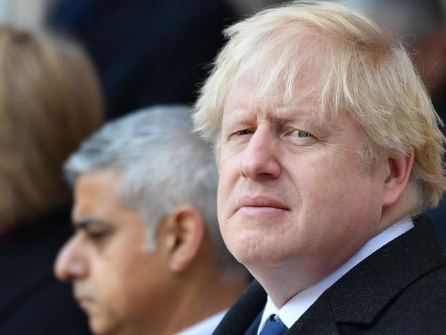 London mayor Sadiq Khan (L) and Britain's Prime Minister Boris Johnson take part in a vigil at the Guildhall in central London to pay tribute to the victims of the London Bridge terror attack. Picture: AFP