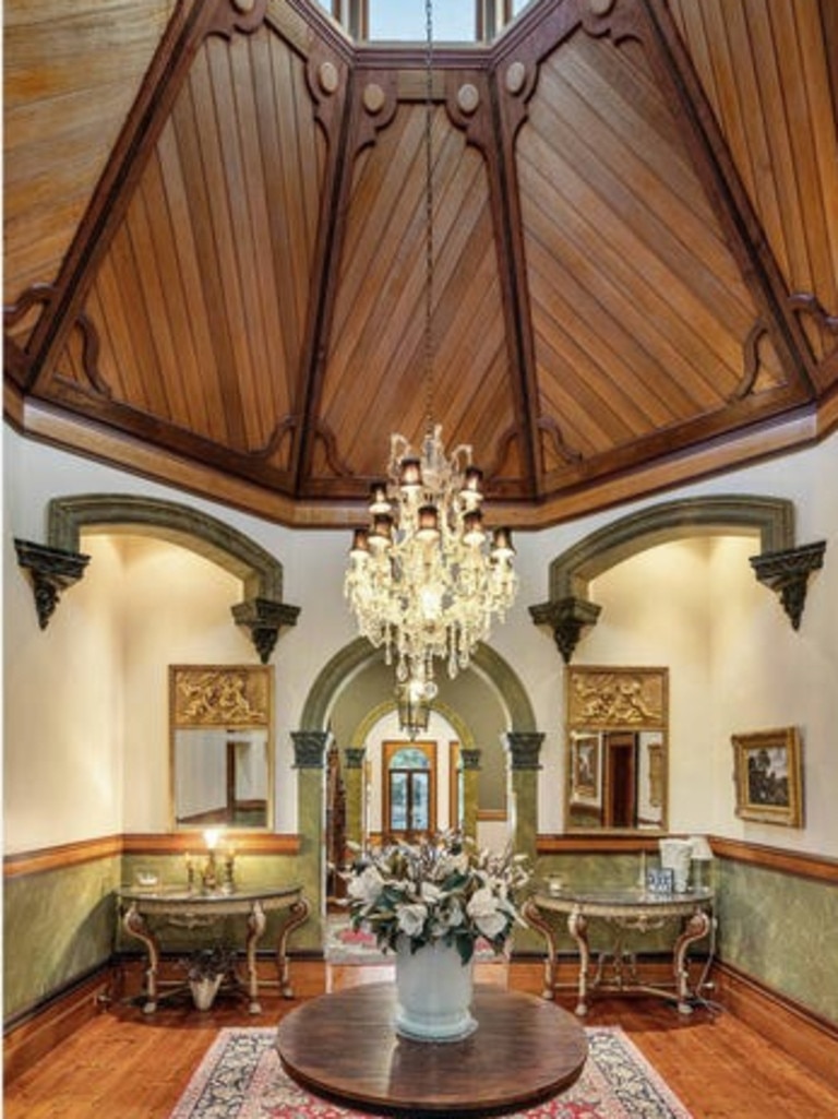 The domed ceiling and chandelier are striking features.