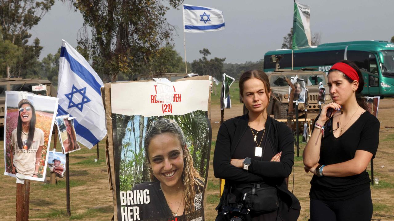 Women gather at the abandoned site of the Supernova music festival after the attack by Hamas militants on October 7, near Kibbutz Reim in southern Israel. Picture: AFP