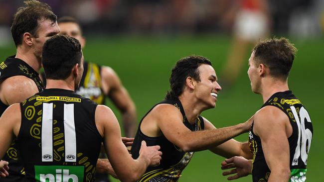 Daniel Rioli celebrates a goal after coming on late against Essendon last week.