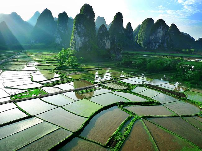 Featuring towering limestone mountains along the Li River, it’s a stunning backdrop that is a photographer’s dream. Photo: istock