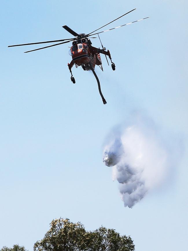 A fatal car crash has sparked an out of control bush fire south of Kurri Kurri at Pelaw Main. Picture: Peter Lorimer.