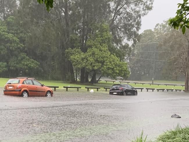 Cars submerged in flood waters in Nuban Street at Currumbin Waters. Photo:  Breeza Tolan/Facebook