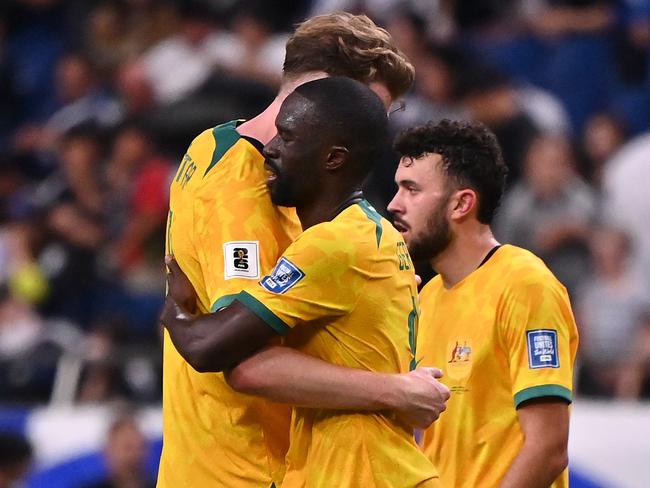 SAITAMA, JAPAN - OCTOBER 15: Harry Souttar, Jason Geria and Patrick Yazbek of Australia react after the 1-1 draw in the FIFA World Cup Asian Third Qualifier Group C match between Japan and Australia at Saitama Stadium on October 15, 2024 in Saitama, Japan.  (Photo by Kenta Harada/Getty Images)