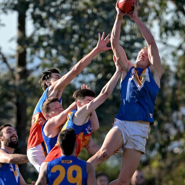 Isaacs flies for a grab. Picture: Andy Brownbill