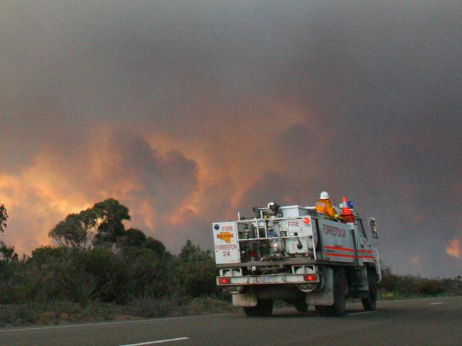 Kangaroo Island bushfires - Firefighting trucks heading toward latest fire front on the West End Highway.