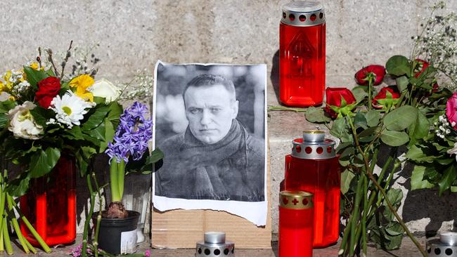 Flowers and candles at a makeshift memorial for late Kremlin critic Alexei Navalny in Zagreb. Picture: AFP.