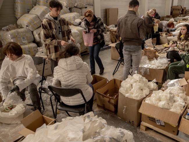 Volunteers work in a humanitarian aid facility in Zaporizhzhia, Ukraine. Picture: Chris McGrath/Getty Images