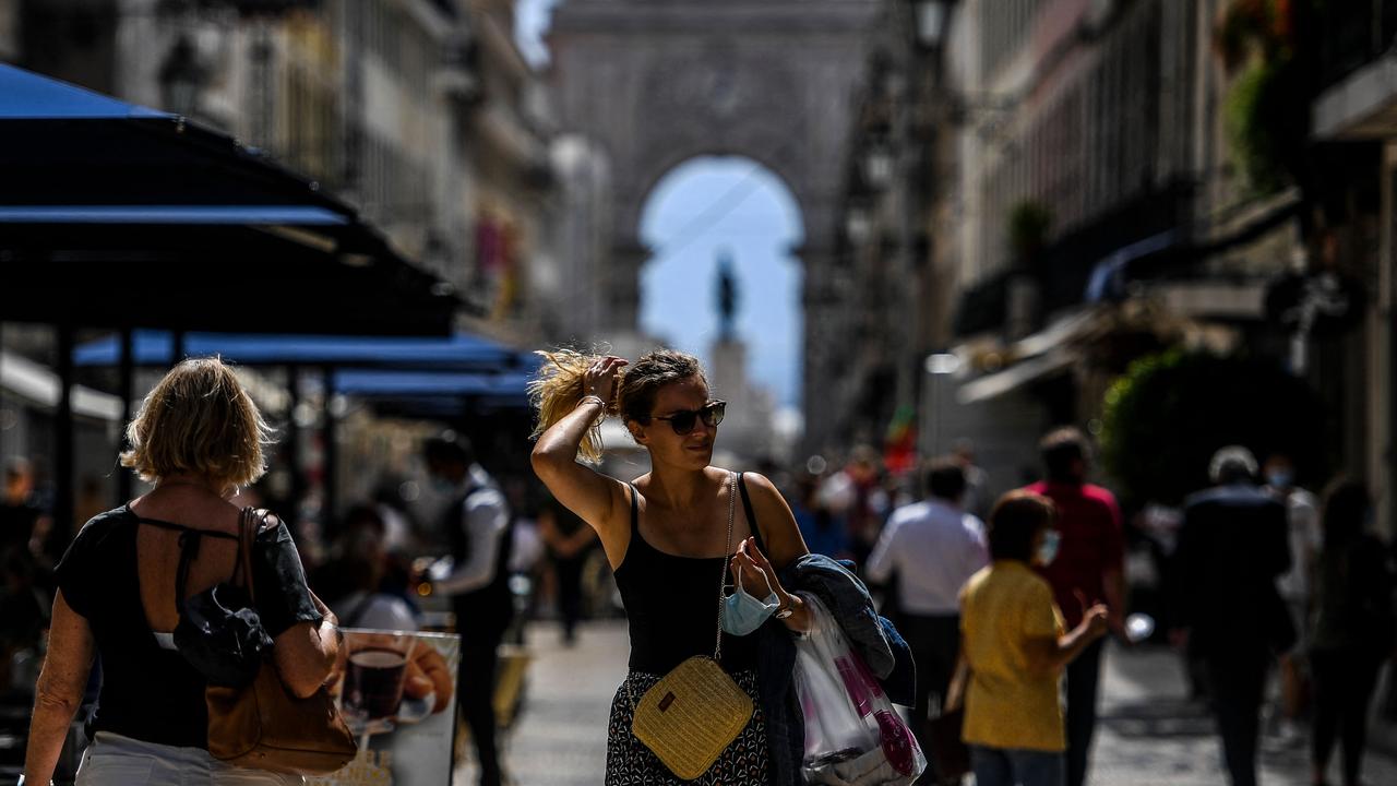 Health officials in the country said people should still carry a mask with them at all times. Picture: Patricia De Melo Moreira / AFP