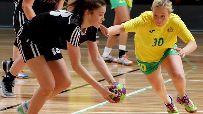 Australia’s Brianna Keyes attacks a New Zealand player for the ball.