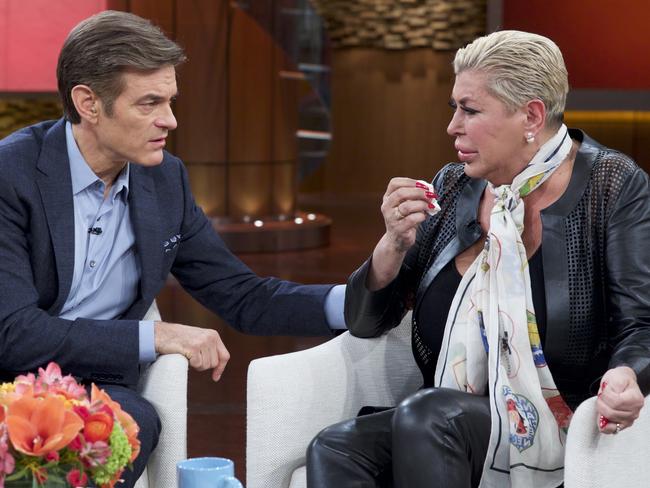 Earlier this week ... Dr. Mehmet Oz, left, comforts Angela "Big Ang" Raiola during a taping of The Dr. Oz Show, in New York. Picture: AP