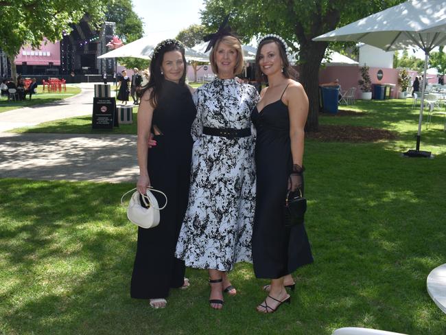 Guests in striking racewear at Penfolds Derby Day at the Flemington Racecourse on Saturday, November 02, 2024: Nerissa Baban, Irine Moore and Laura Gilmore. Picture: Jack Colantuono