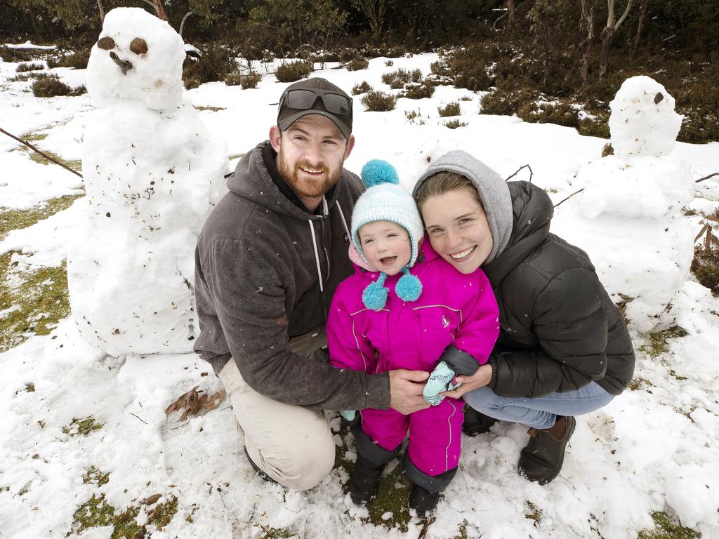 Corey Rowell, Chelsea Hingston and Annie Hingston- Rowell 2 enjoy the snow at Cradle Mountain. PICTURE CHRIS KIDD