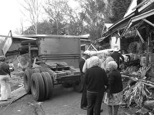 Historic: Toowooba: Accidents Semi-trailer crash at the Log Cabin Service Station on the Toowoomba Range in on 6th September,1978. Three men suffered minor injuries during the crash when the semi-trailer rolled taking out petrol bowsers. A car parked at the service station was also damaged. Photo: Bruce Mackenzie / The Chronicle Neg U869. Picture: Bruce Mackenzie