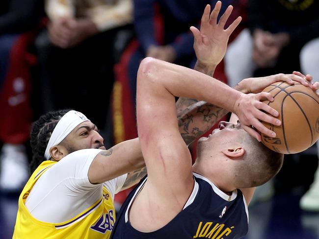 Anthony Davis of the Los Angeles Lakers blocks Nikola Jokic of the Denver Nuggets in Denver, Colorado. NBA Playoffs 2024. (Photo by Matthew Stockman/Getty Images)