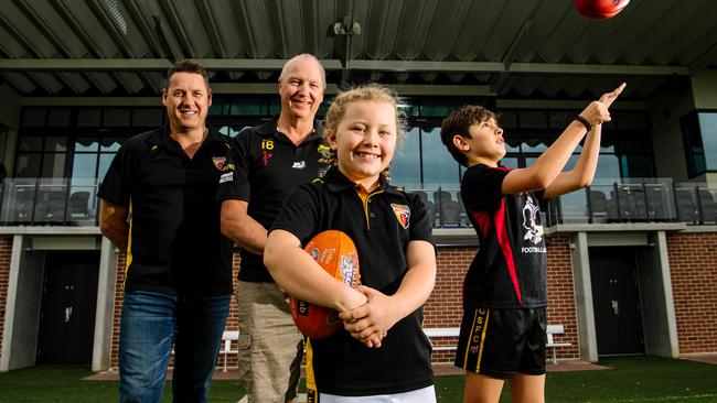 Goodwood club President Craig Scott, junior football director Andrew Braley, Holly, 8, and Harrison, 11. Picture: Morgan Sette