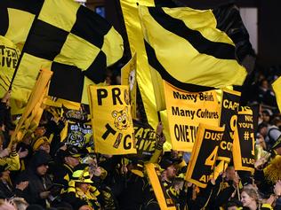 Fans of the Tigers are seen in action during the second qualifying final between the Geelong Cats and the Richmond Tigers at MCG in Melbourne, Friday, September 8, 2017. (AAP Image/Julian Smith) NO ARCHIVING, EDITORIAL USE ONLY