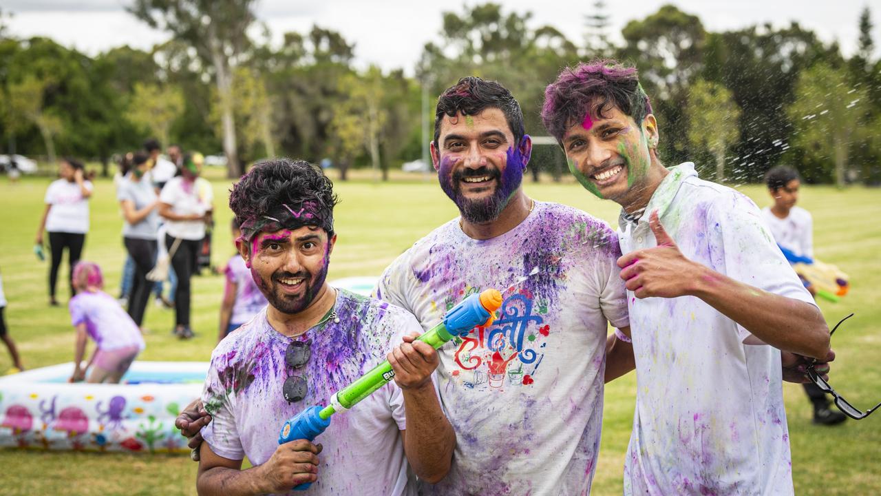 Celebrating Holi are (from left) Rikesh Shrestha, Diwas Chapagain and Dhiraj Dahal as Toowoomba Indian and Nepalese communities unit for the festival of colours, Saturday, March 23, 2024. Picture: Kevin Farmer