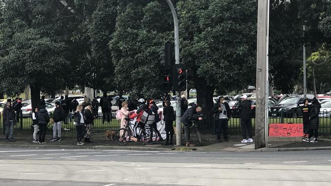 Protesters gather on Racecourse Road in Flemington. Picture: Remy Varga