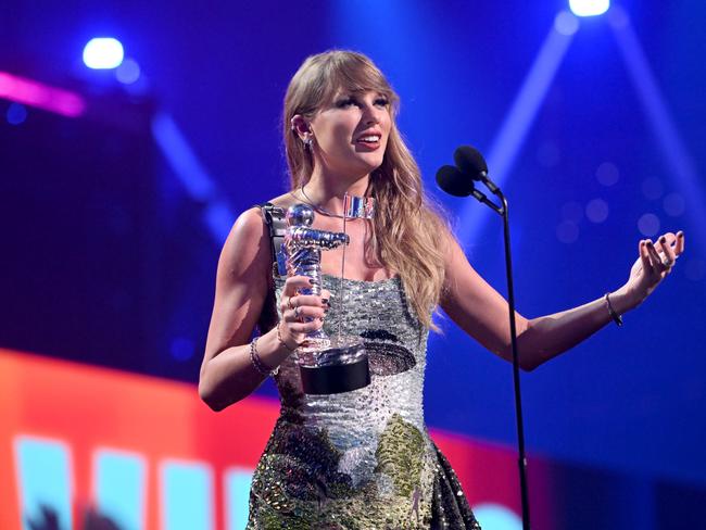 ELMONT, NEW YORK - SEPTEMBER 11: Taylor Swift accepts the the Video of the Year award (Presented by Burger King) for "Fortnight" on stage during the 2024 MTV Video Music Awards at UBS Arena on September 11, 2024 in Elmont, New York.  (Photo by Noam Galai/Getty Images for MTV)