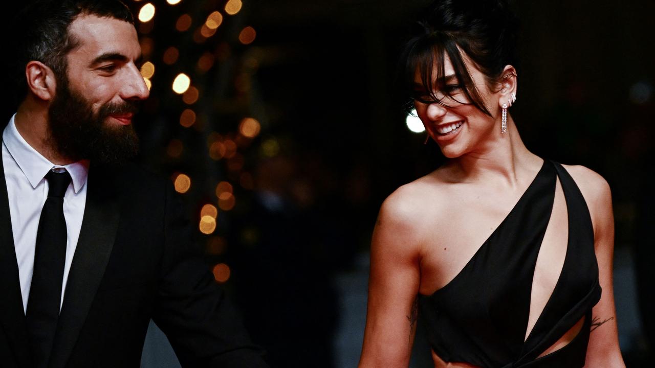 The happy couple were all smiles at Cannes. Picture: Loic Venance/AFP