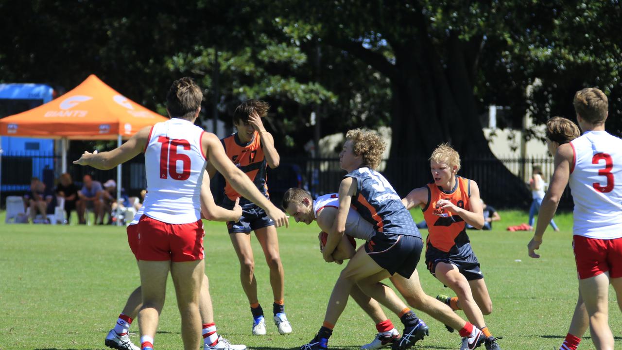 Josh Hanlon lays a tackle in a game for the GWS academy. Picture: GWS media.