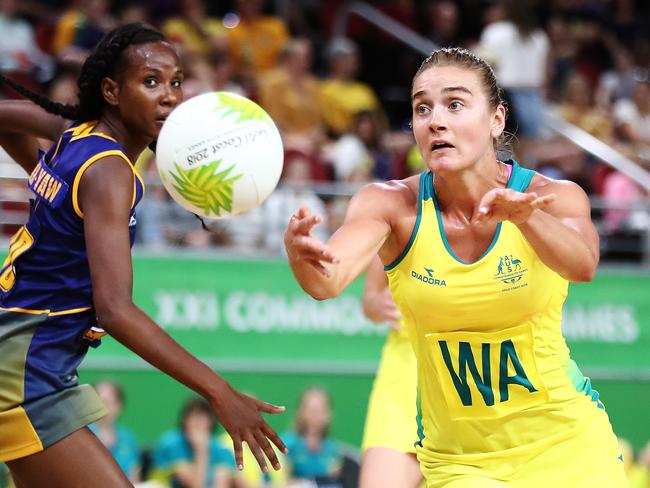 GOLD COAST, AUSTRALIA - APRIL 06:  Liz Watson of Australia passes the ball out during the Netball Preliminary Round Pool A match between Australia and Barbados on day two of the Gold Coast 2018 Commonwealth Games at Gold Coast Convention and Exhibition Centre on April 6, 2018 on the Gold Coast, Australia.  (Photo by Hannah Peters/Getty Images)