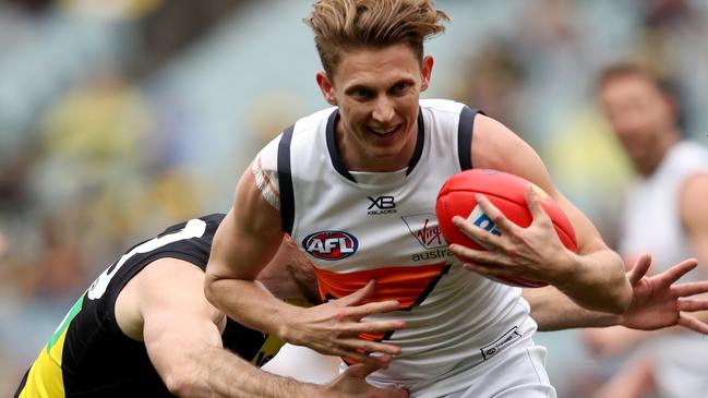 Lachie Whitfield of The Giants marks during the Round 17 AFL match between the Richmond Tigers and the GWS Giants at the MCG in Melbourne, Sunday, July 14, 2019.  (AAP Image/Mark Dadswell) NO ARCHIVING, EDITORIAL USE ONLY