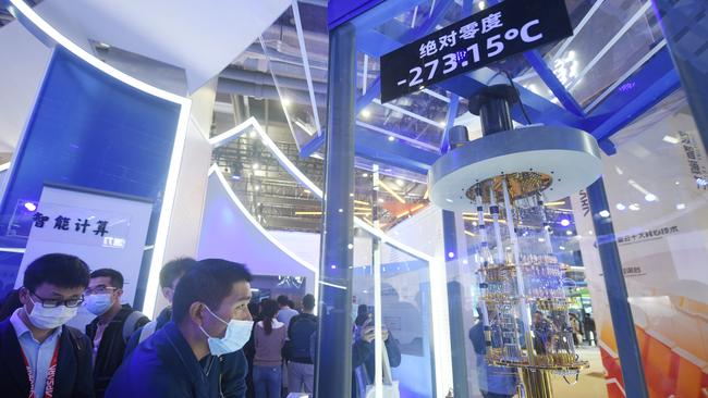 Visitors watch the launch of core components of quantum computer by Alibaba At the Hangzhou Computing Conference in Hangzhou, east China's Zhejiang Province in late 2021.