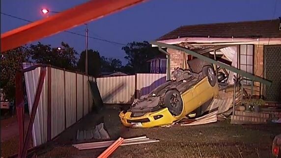 Substantial damage was caused to the brick wall and window frame of the home. Picture: Channel 9 News Qld