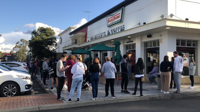 Crowds gather at Krispy Kreme Penrith on Monday as concerns grow over rising COVID-19 cases in Sydney. Picture: Kate Lockley