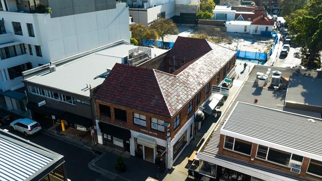 The corner site at 12 Cross St currently consists of a two-storey building, with six shops and six offices.