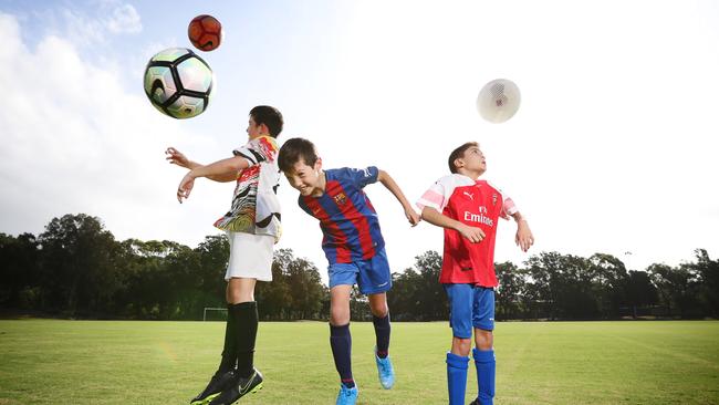 Lucas Wong, Nathan Wong and George Liolios all play football in Sydney’s Inner West. Photo: Richard Dobson