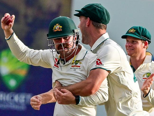 Travis Head celebrates with teammates after taking a ripping catch. Picture: AFP